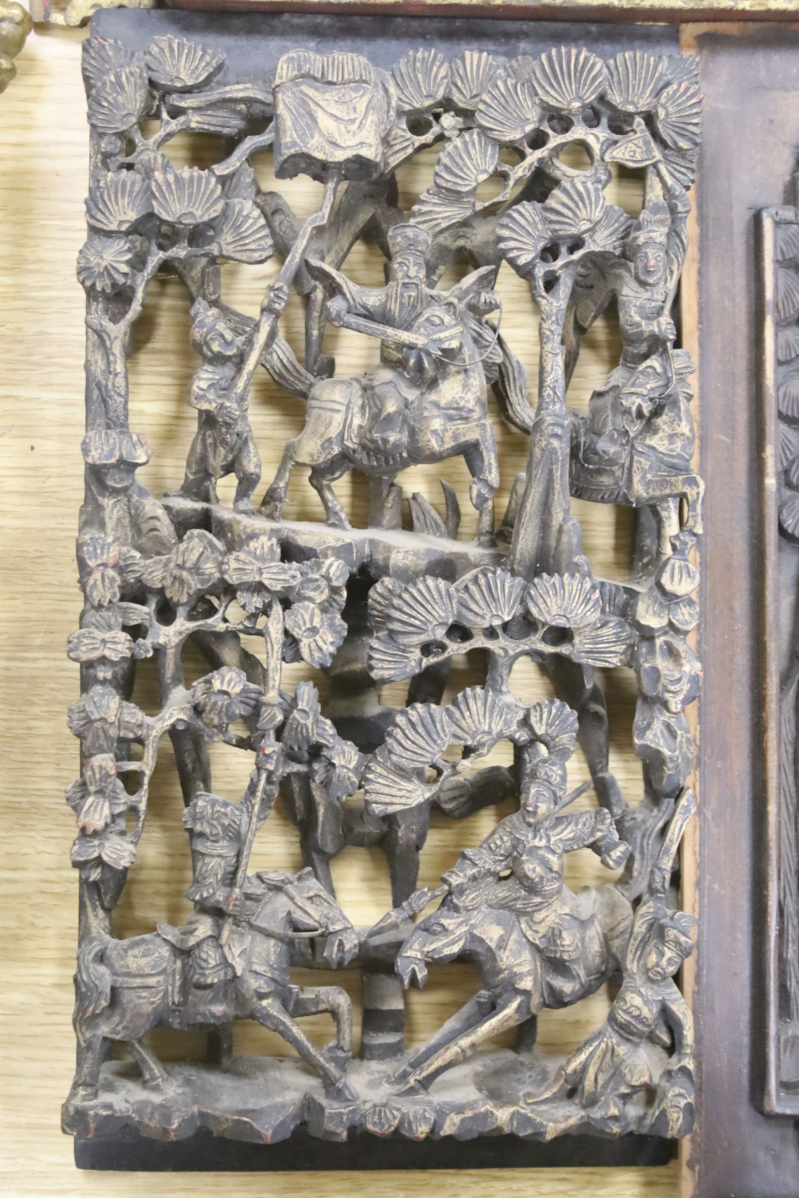 Three Chinese gilt wood carvings, largest 33.5cm and a wood panel 36.5cm